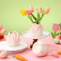 Set of three pink tulip-shaped mini ceramic vases with scalloped rim for tabletop flowers