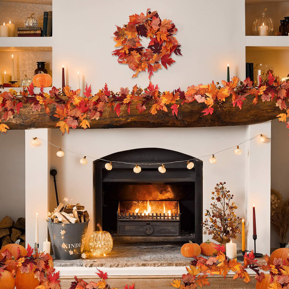 Fall maple leaf garland with orange and red leaves draped along a mantel