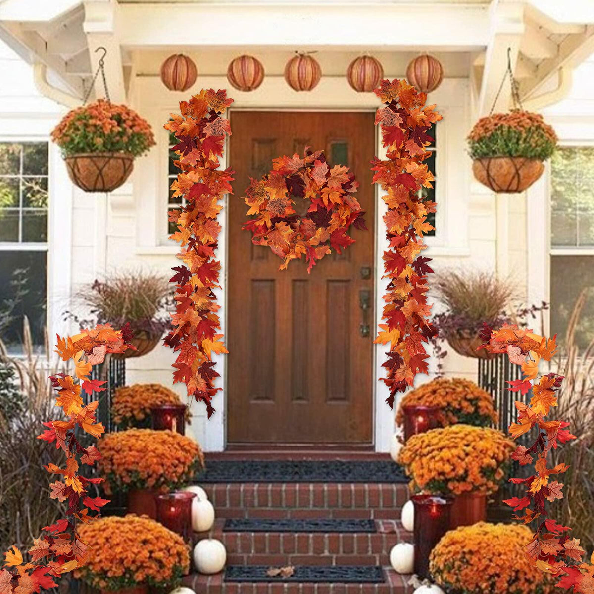 Autumn maple leaf garland hanging decor with dense orange and red leaves