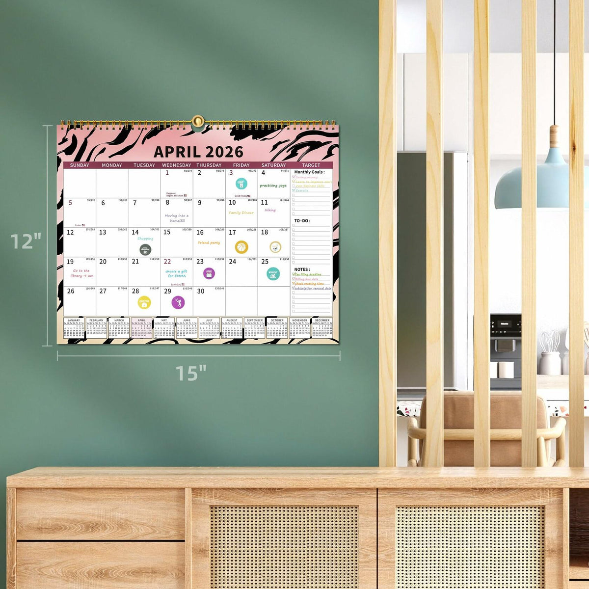 Wall-hanging monthly wall calendar showing April 2026 on wall with decorative frame