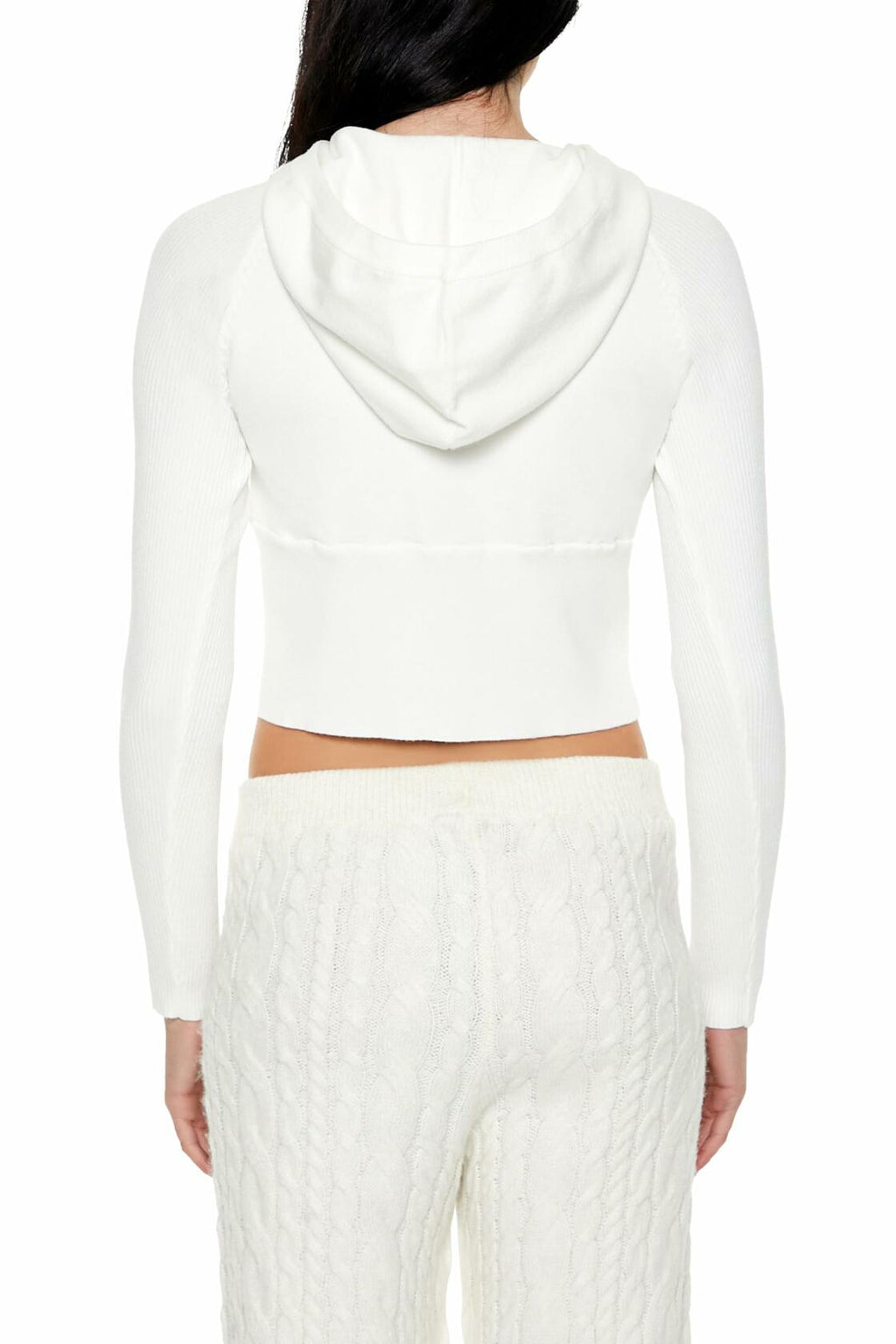 Back view of white hooded raglan sweater with hood down and ribbed cuffs.