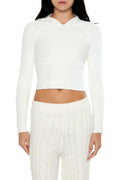 White hooded raglan sweater, cropped knit top with long sleeves and drawstring hood.