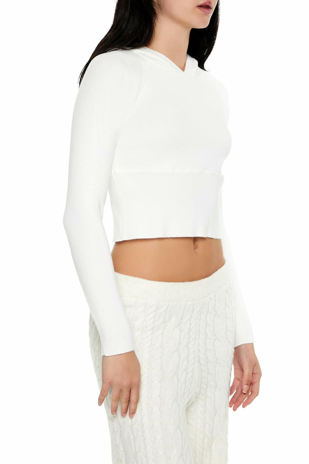 White hooded raglan sweater with V-neck and long sleeves; cropped length at waist.