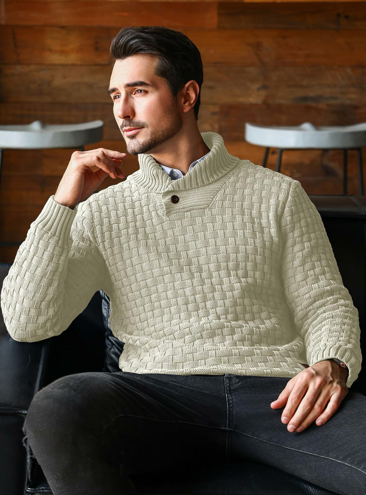 Cream cable-knit shawl-collar pullover sweater with long sleeves and ribbed cuffs