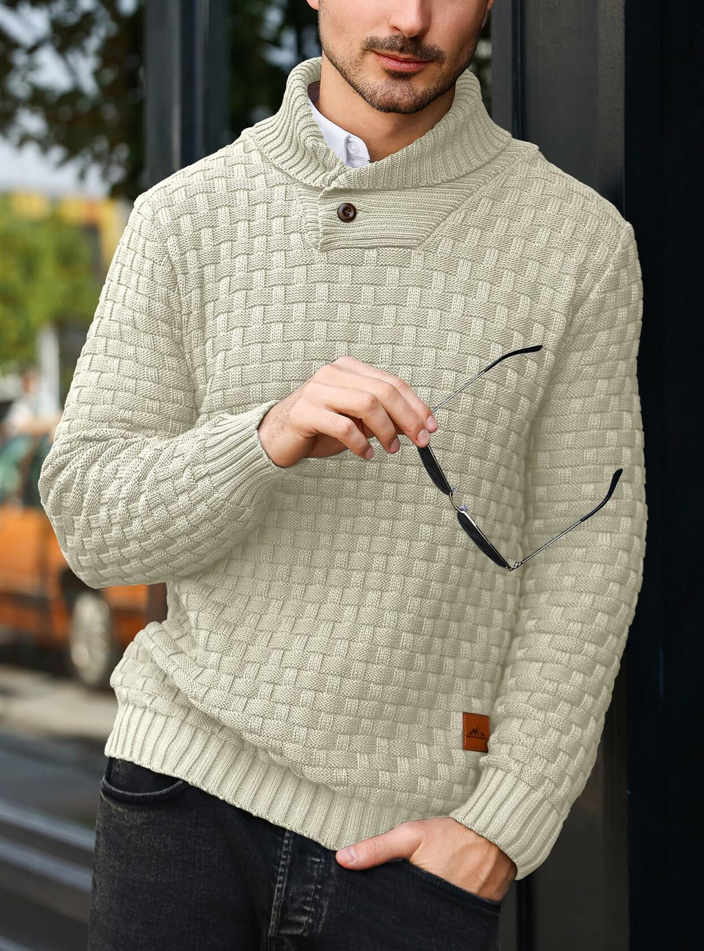 Cream cable-knit pullover sweater with shawl collar and ribbed hem