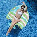 Inflatable striped fish pool raft in green and white with orange fin detail