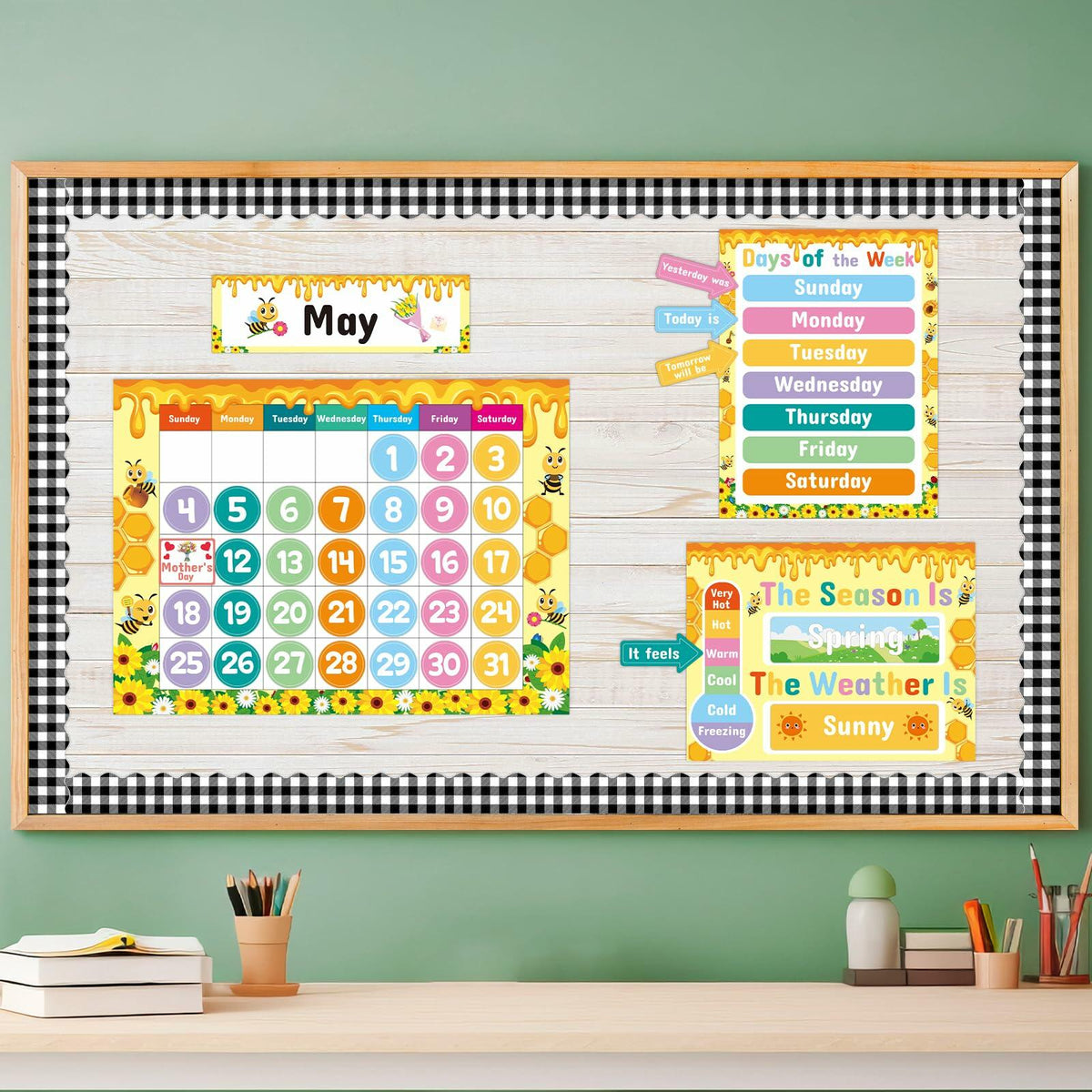 Classroom calendar kit displayed on bulletin board with month and weather charts