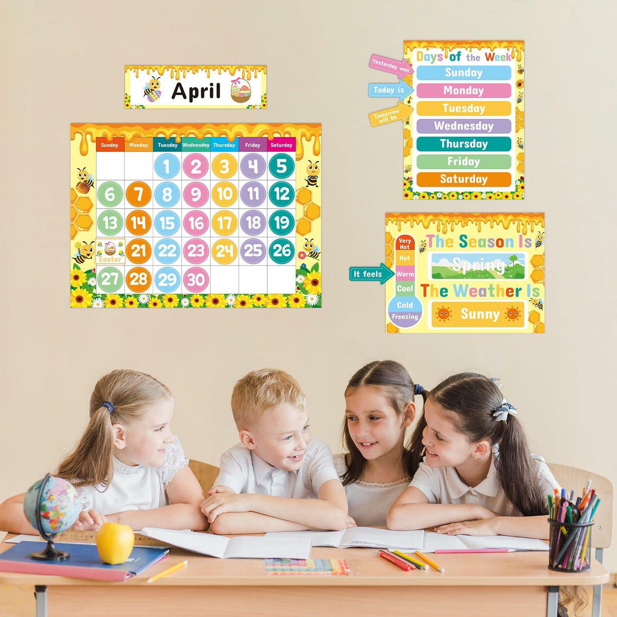 Classroom calendar kit on wall above children doing homework at table