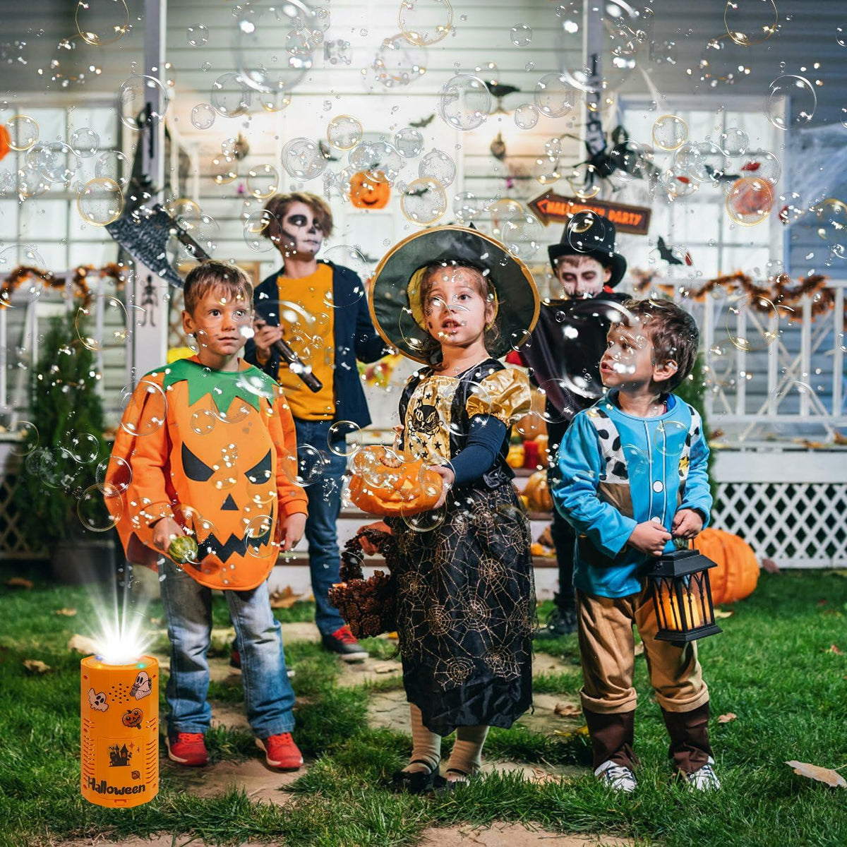 Orange Halloween bubble machine with glowing top beside kids for trick-or-treat