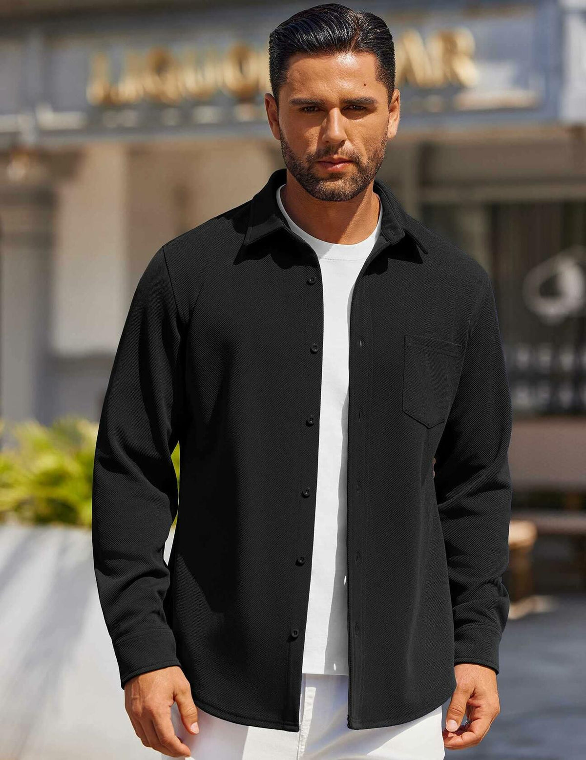 Men's black button-down shirt with spread collar and chest pocket