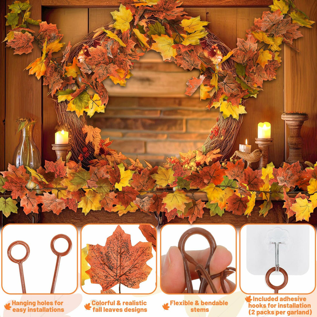 Artificial maple leaf garland wreath-style with orange and yellow leaves and hanging loops
