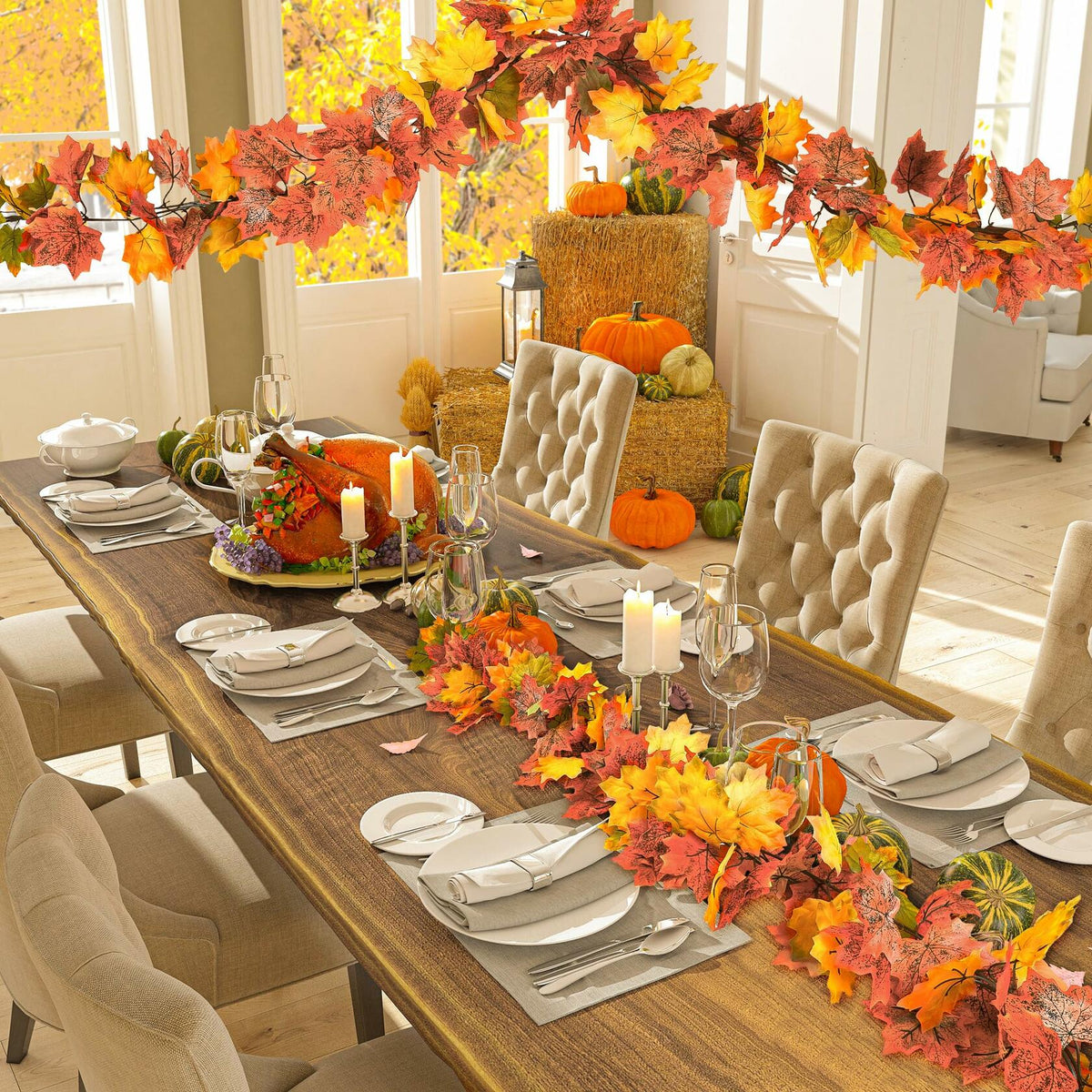 Artificial fall maple leaf garland with orange and yellow leaves draped along window