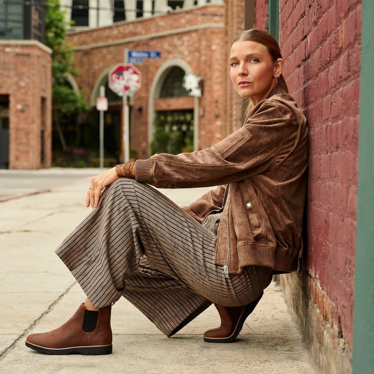 Brown ankle boots with elastic side panels and thick tread sole