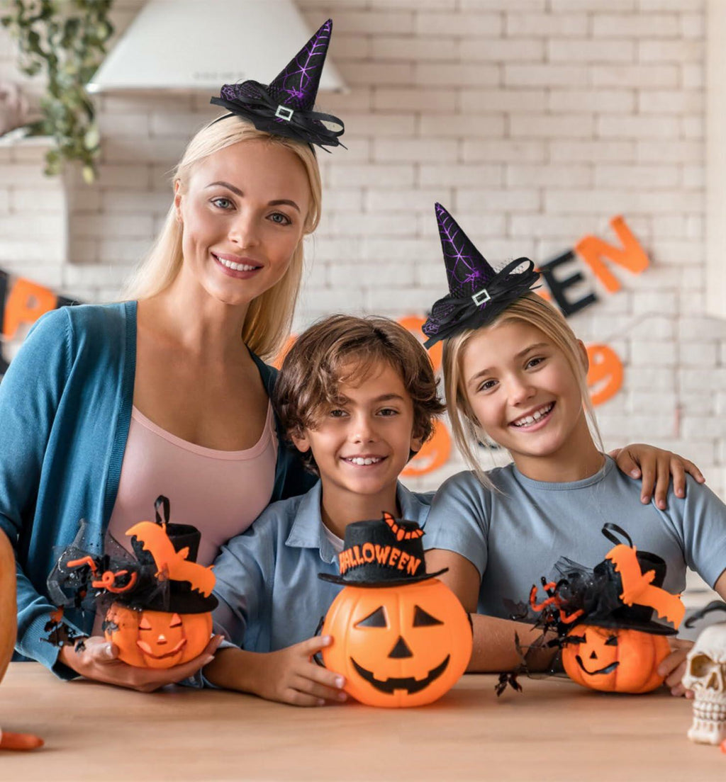 Purple witch hat headband with black bow and elastic band, worn on a child’s head
