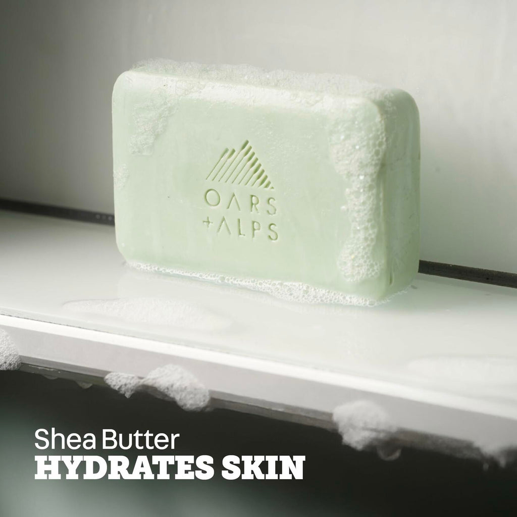 Oars + Alps Epsom Salt bar soap, mint-green bar with logo on a shelf