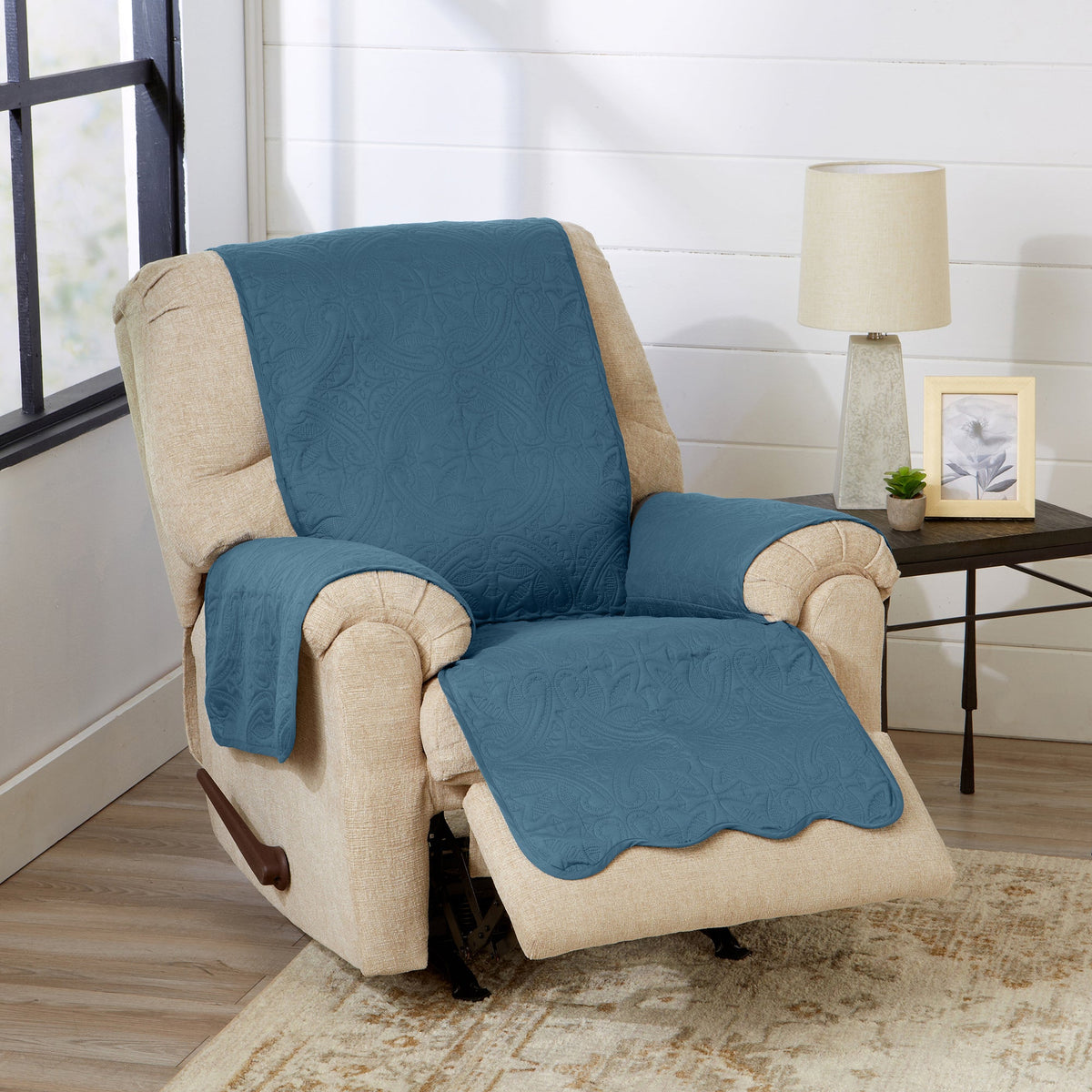 Blue and beige recliner furniture protector with quilted texture on chair