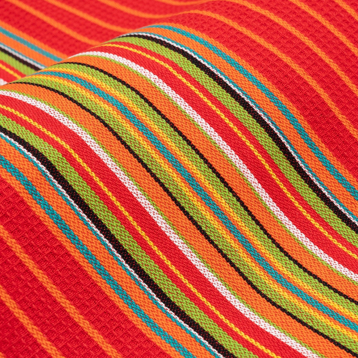 Close-up of red kitchen towel with multicolor striped weave