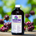 Immunity formula supplement bottle with purple label, 16 fl oz (473 mL)
