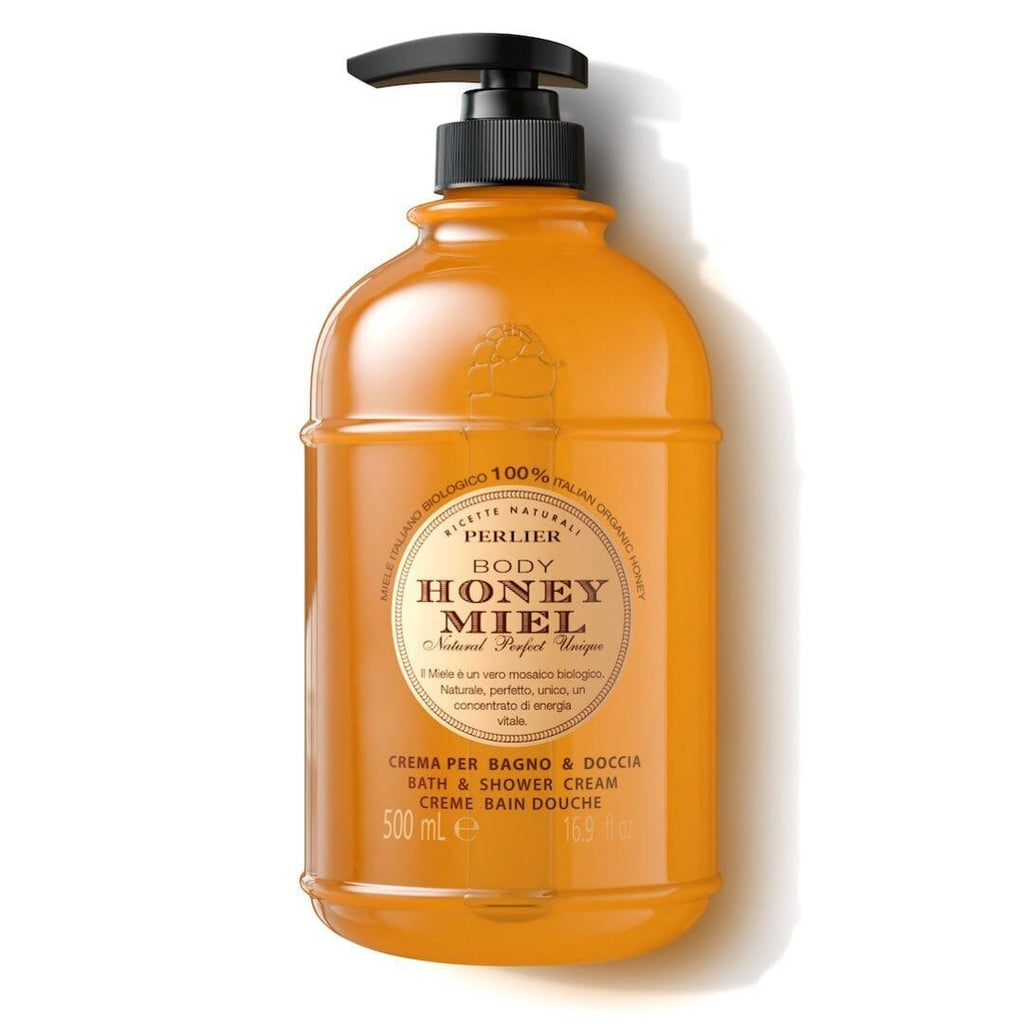 Orange honey bath and shower cream bottle with black pump dispenser