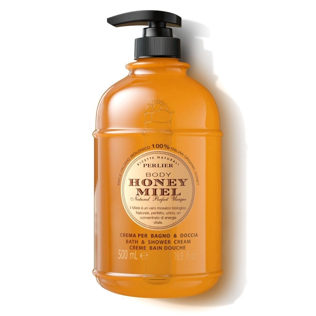 Orange honey bath and shower cream bottle with black pump dispenser