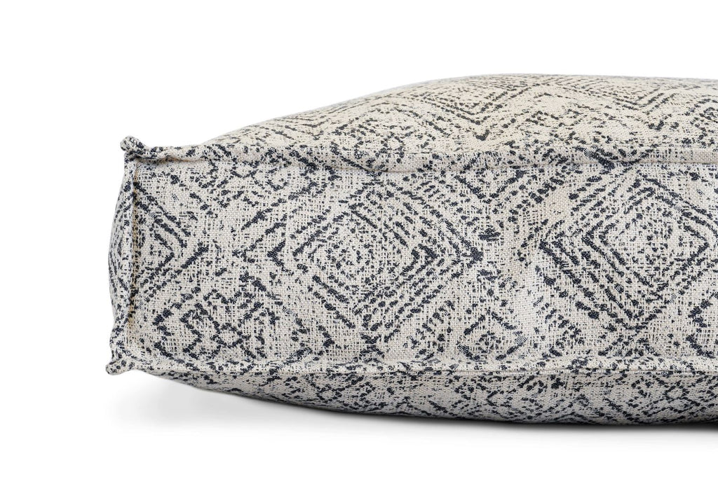 Gray zigzag patterned pet lounger bed cover, showing side seam and rounded corner
