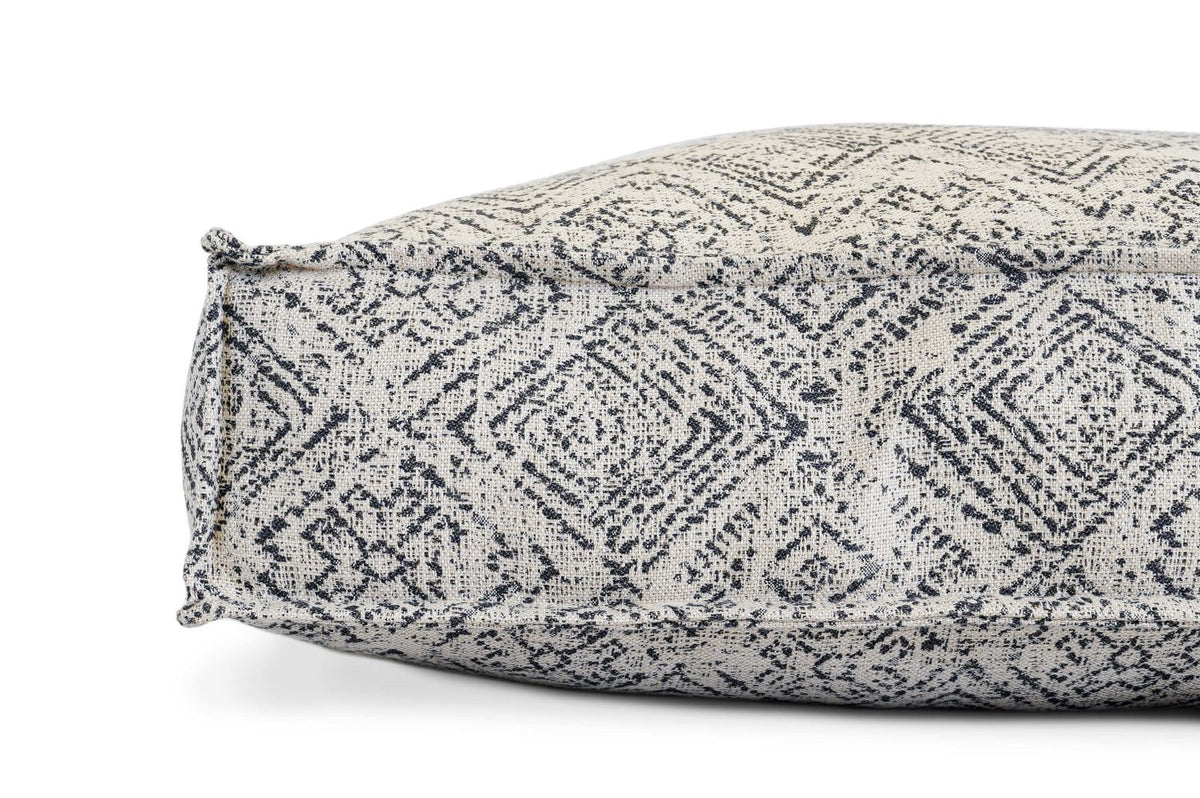Gray zigzag patterned pet lounger bed cover, showing side seam and rounded corner