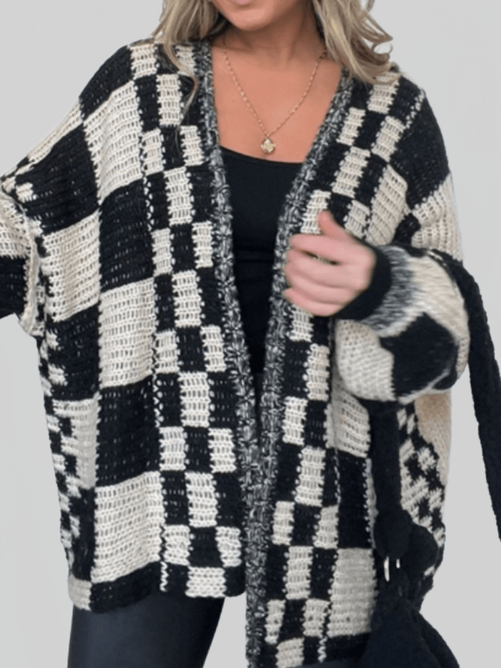 Women’s plaid open-front cardigan sweater with long sleeves, black and cream