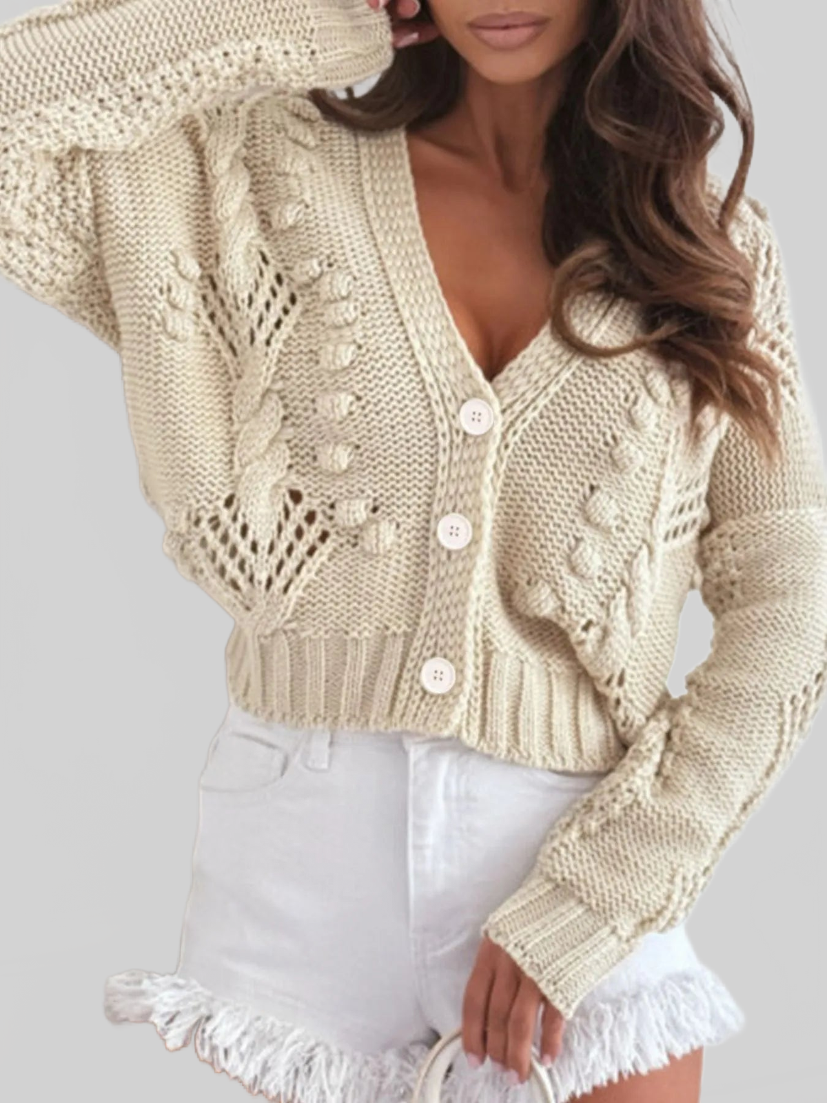 Beige cropped cable-knit cardigan with V-neck, button front, textured sleeves
