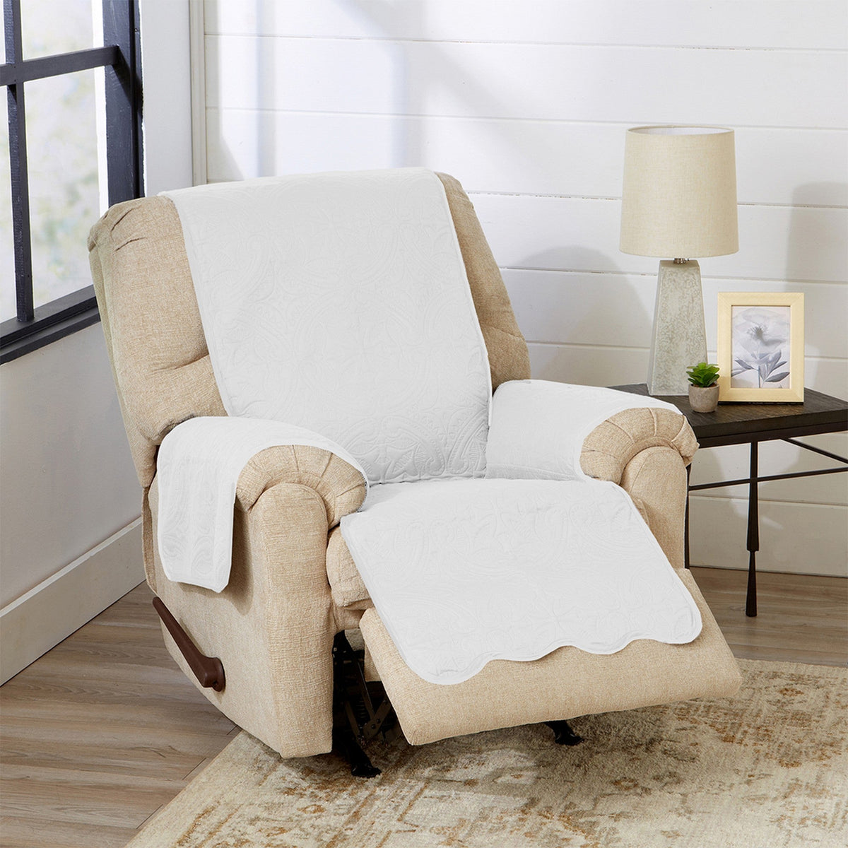 White armchair protector with beige trim on chair seat, arms, and back