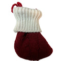 Knitted stocking ornament with white ribbed leg and red toe and heel