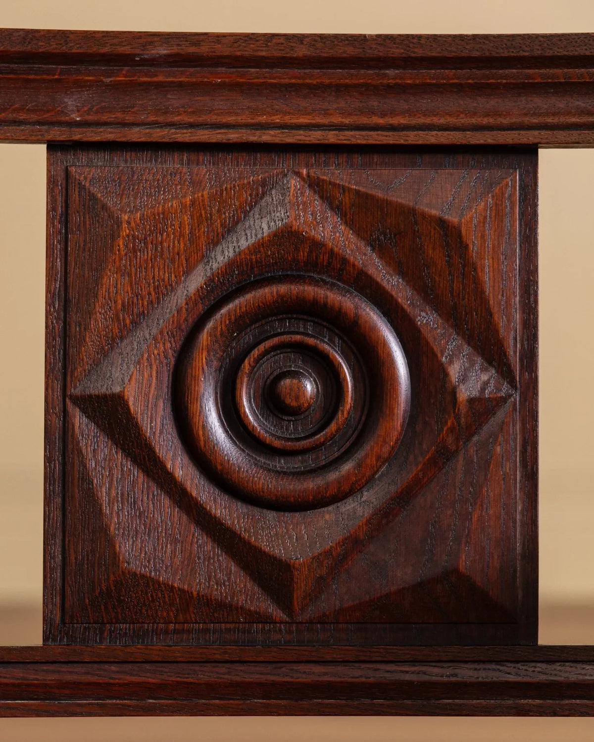 Wood chair backrest panel with circular rosette carving and geometric diamond motif