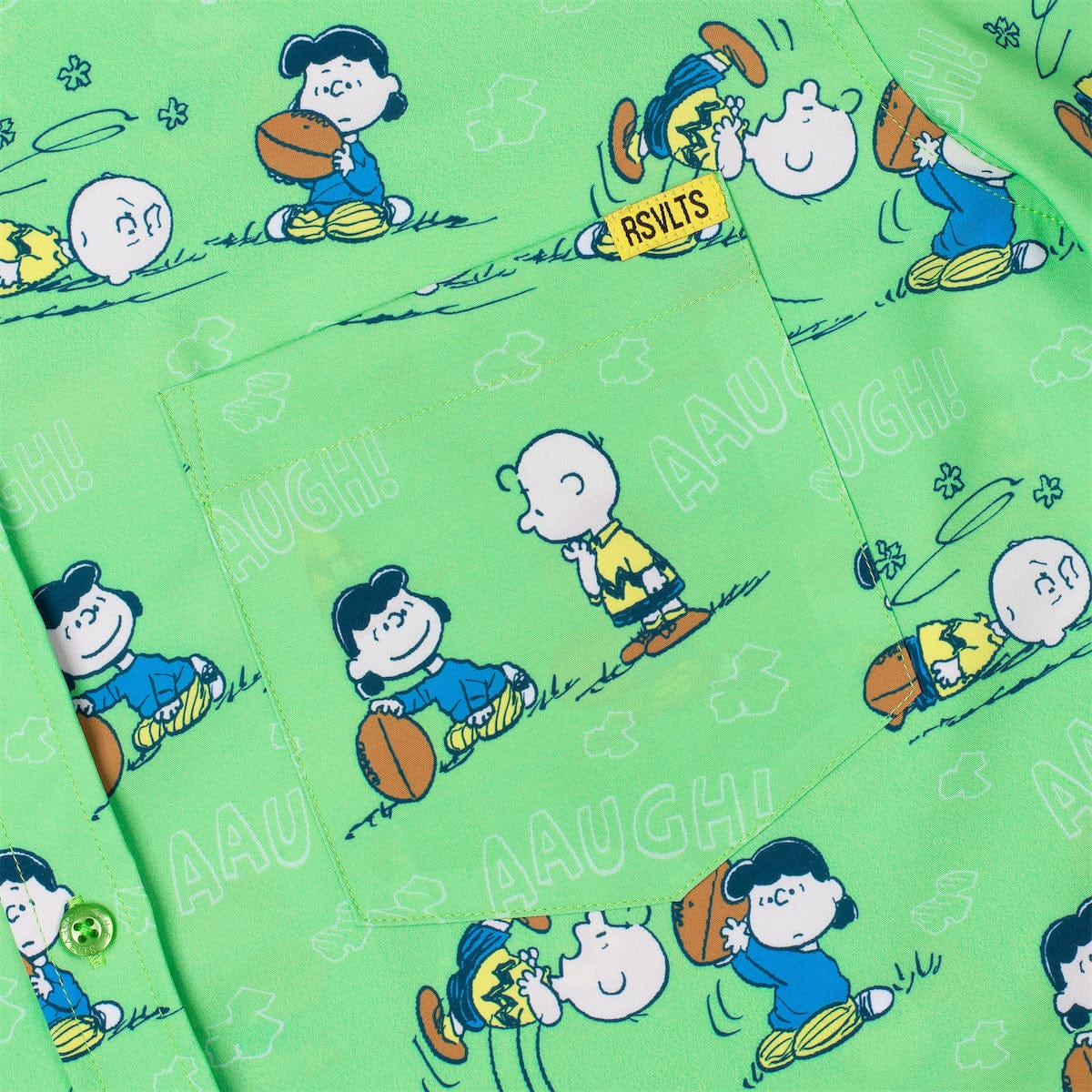 Green short-sleeve shirt close-up with Peanuts characters and AAAUGH text pattern