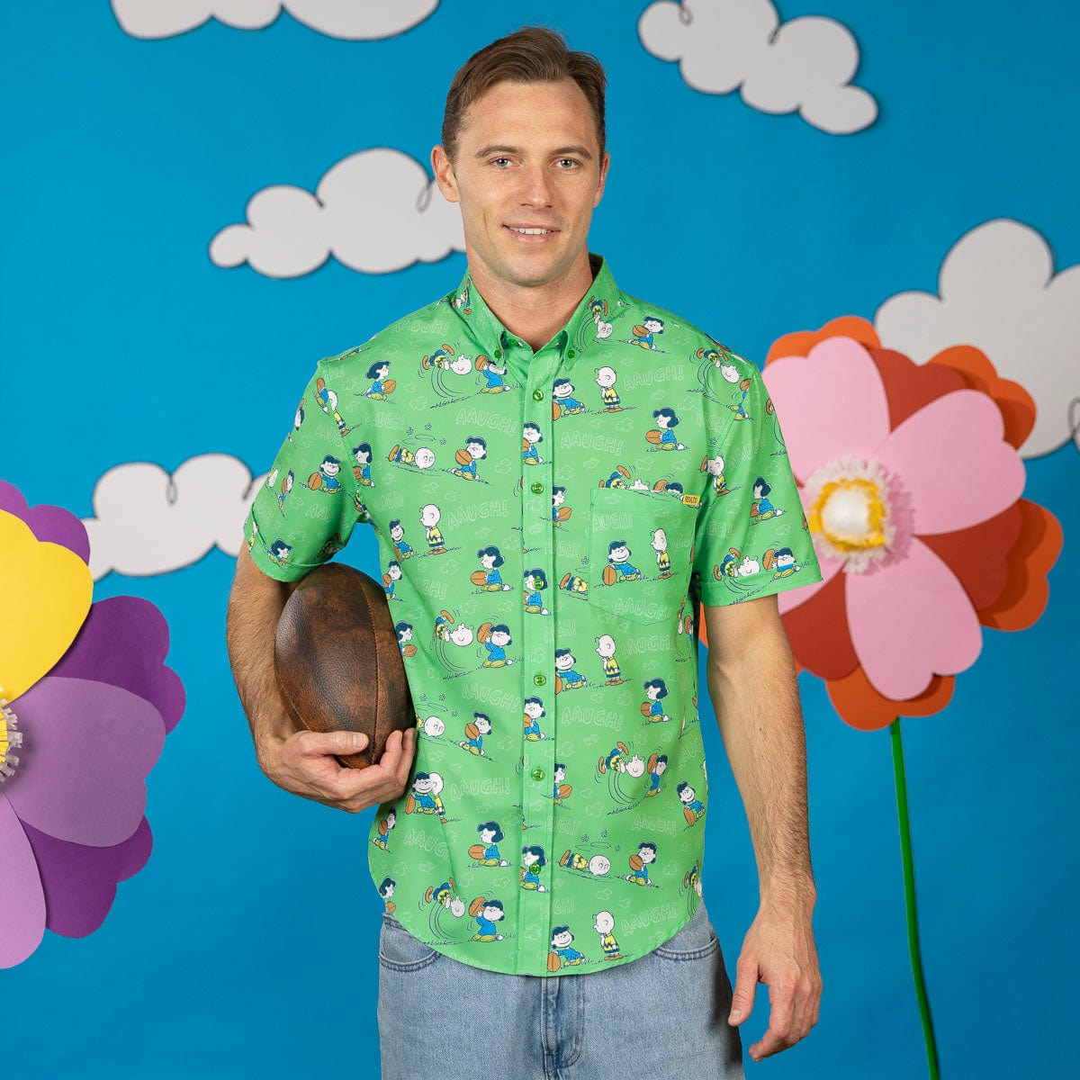 Green short-sleeve Peanuts character button-up shirt on male model, front view