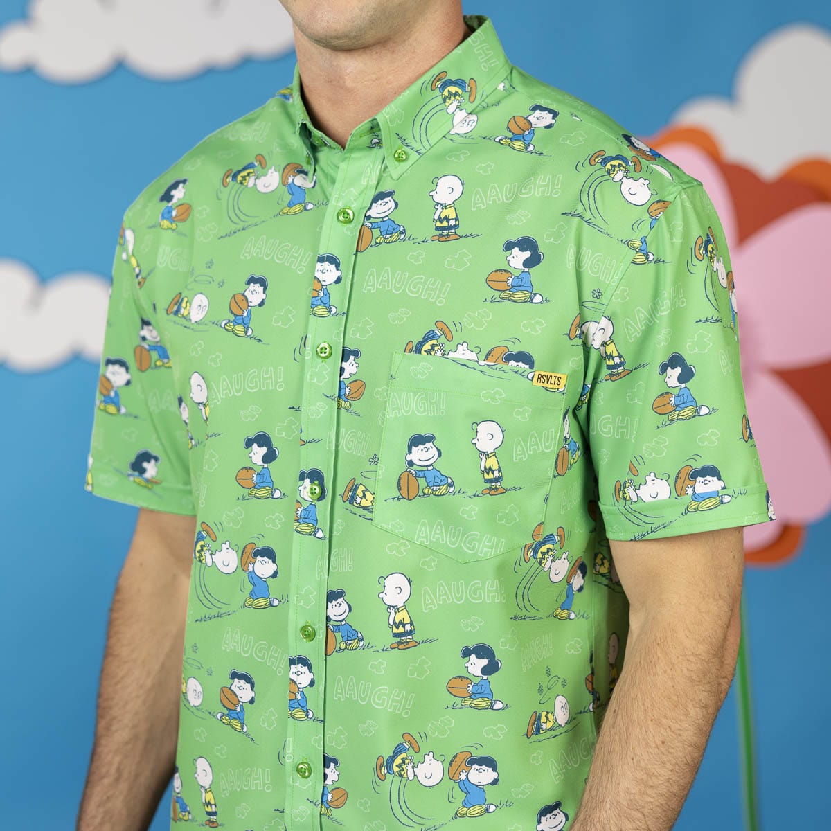 Green short-sleeve button-up shirt with Peanuts characters and front placket detail