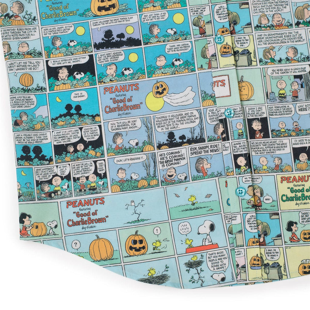 Peanuts comic strip pattern on light blue fabric with pumpkins and speech bubbles