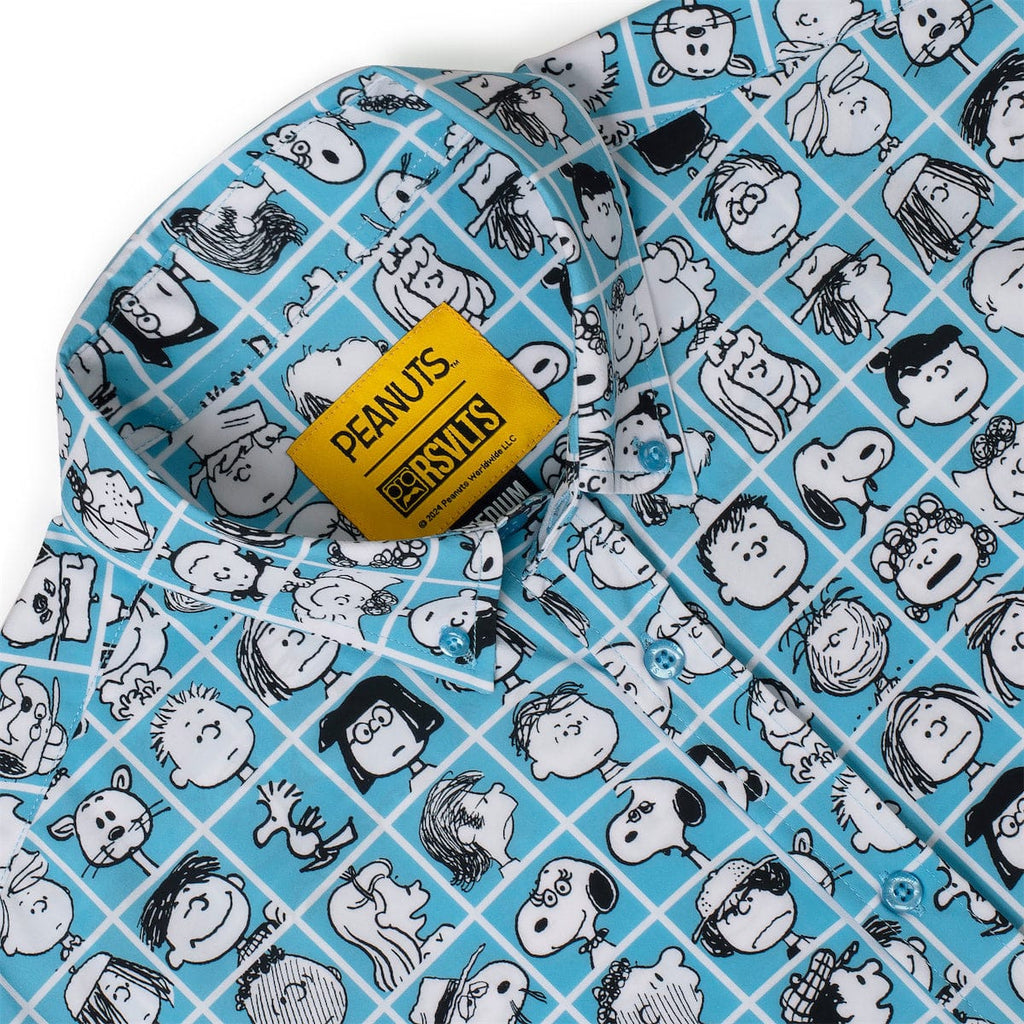 Blue fabric detail of Peanuts characters on checkered grid with yellow brand label