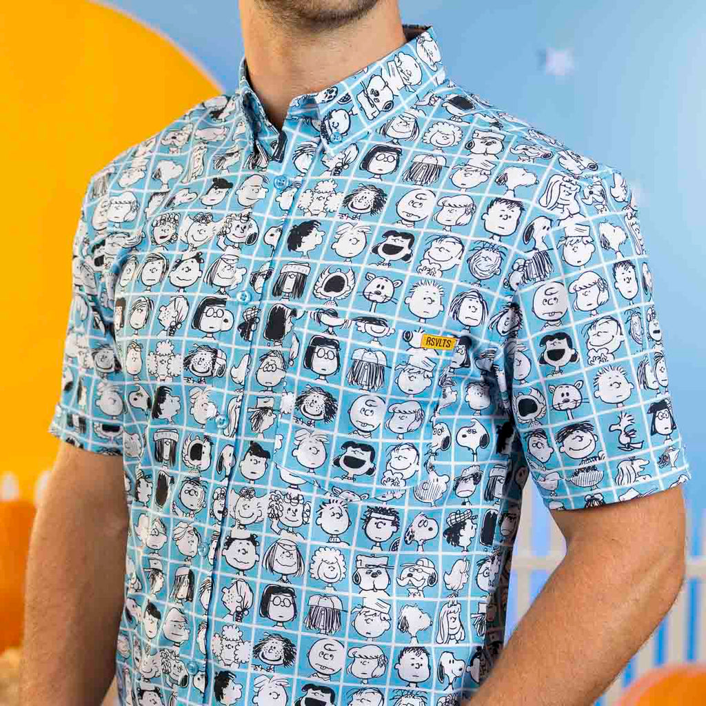 Blue short-sleeve button-front shirt with Peanuts character faces pattern