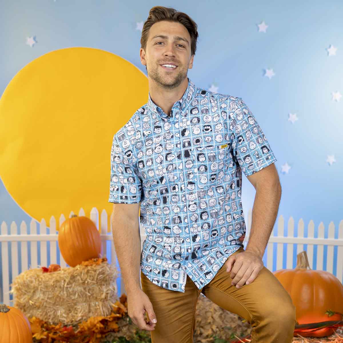 Peanuts printed short-sleeve collared shirt in blue, worn by model