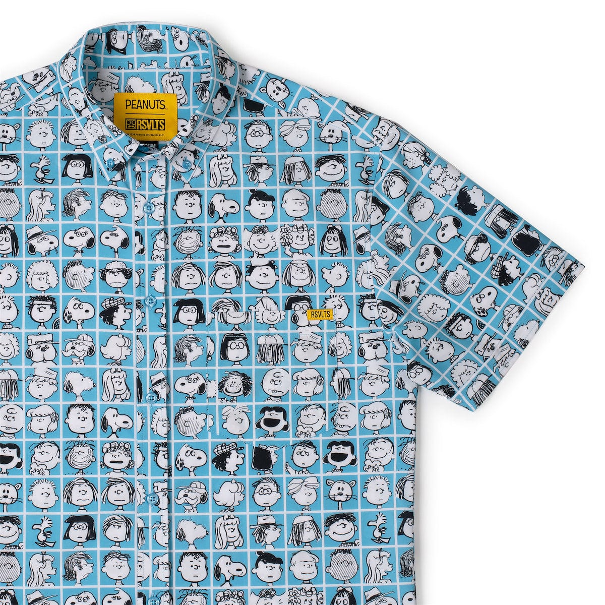 Blue short-sleeve collared shirt with Peanuts character grid print and branded patch at chest