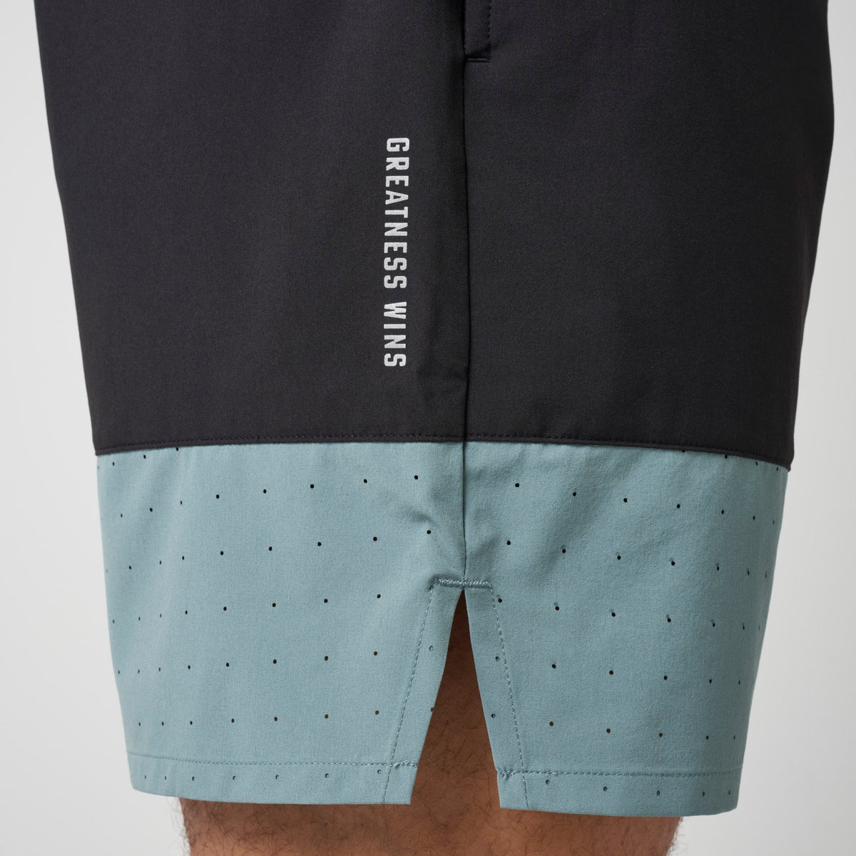 Black and steel blue performance training shorts with dotted lower panel and “GREATNESS WINS”