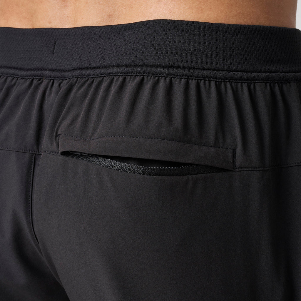Black performance training shorts back yoke with elastic waistband and seam detail