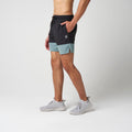 Performance training shorts in black with steel blue side panels and drawstring waist
