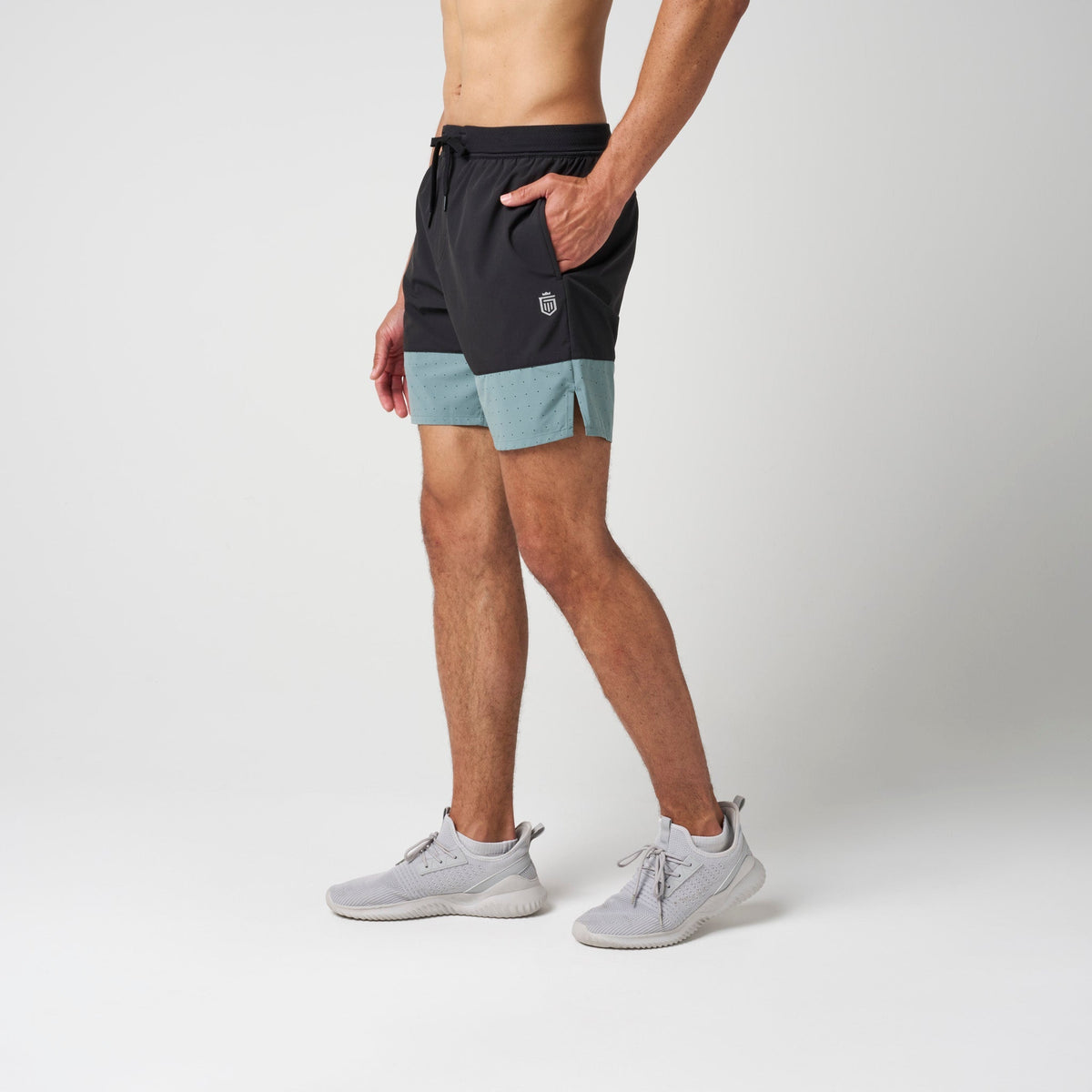 Performance training shorts in black with steel blue side panels and drawstring waist