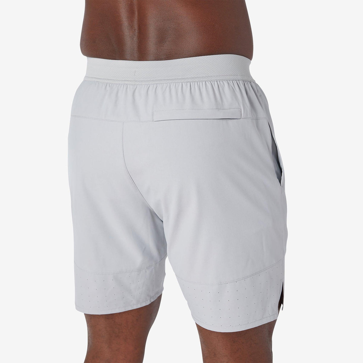 Ash gray training shorts back view with elastic waistband and stitched panels