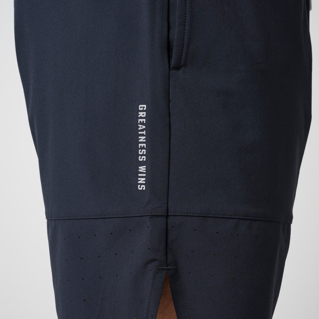 Navy shorts with 'GREATNESS WINS' text on back and vented lower panel.