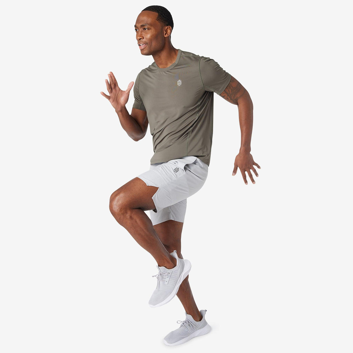 Ash gray performance shorts with drawstring waist and angled side pocket