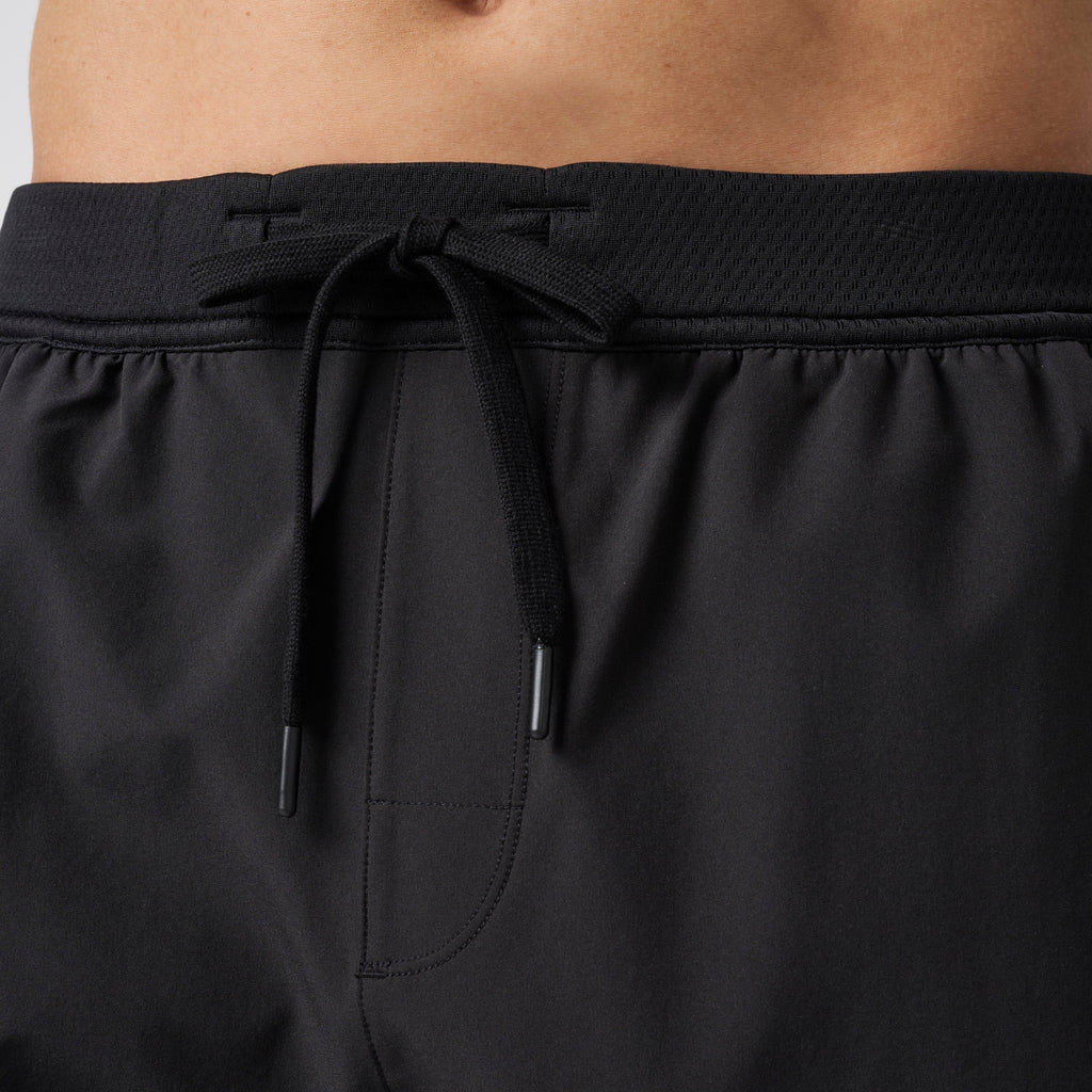 Black performance training shorts with elastic waistband and black drawstring