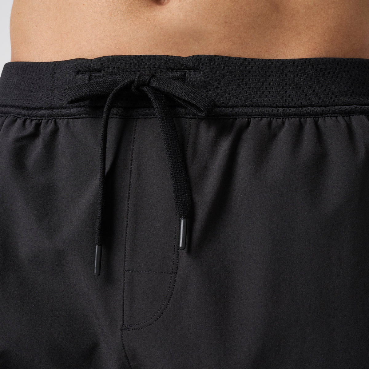 Black performance training shorts with elastic waistband and black drawstring