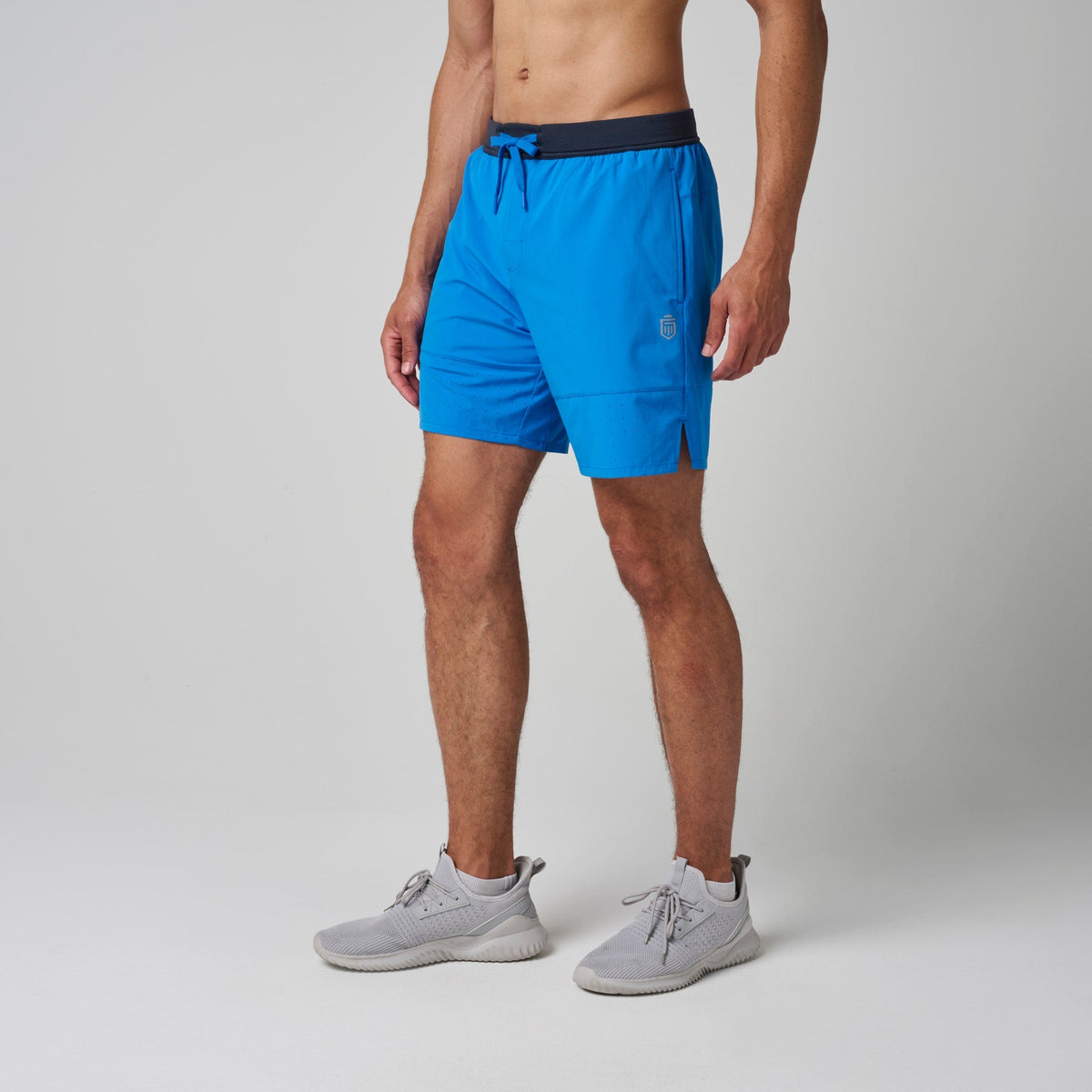 Men's performance training shorts in bright blue with navy drawstring waistband