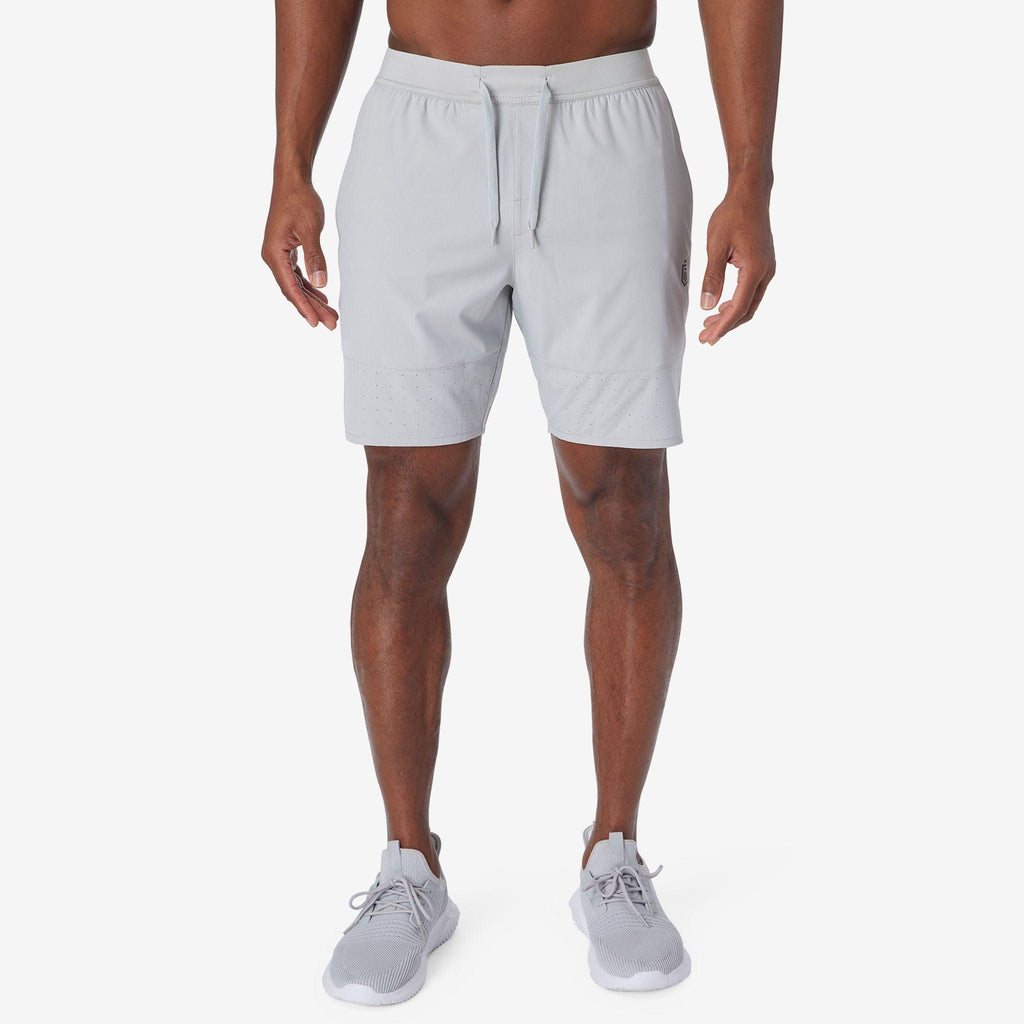 Ash gray training shorts with drawstring waistband and straight knee-length cut
